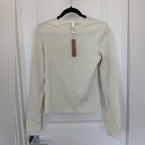 SKIMS 	COTTON JERSEY LONG SLEEVE T-SHIRT | BONE